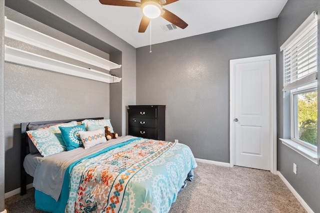 carpeted bedroom with ceiling fan