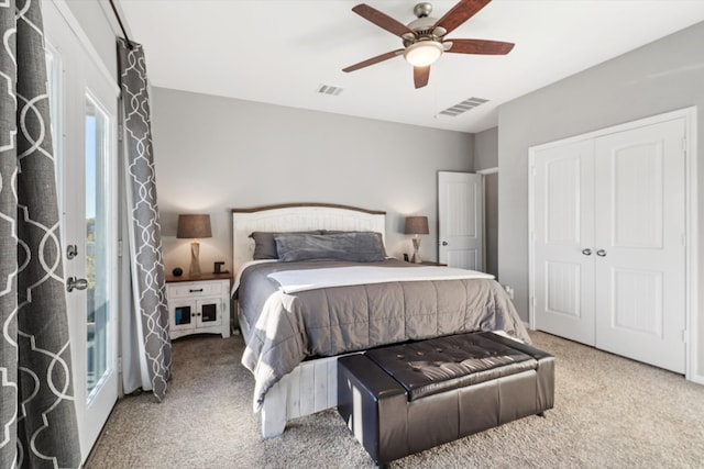 bedroom with multiple windows, carpet floors, a closet, and ceiling fan