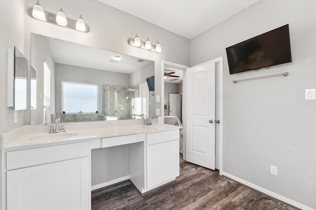 bathroom featuring ceiling fan, a shower with door, vanity, and wood-type flooring