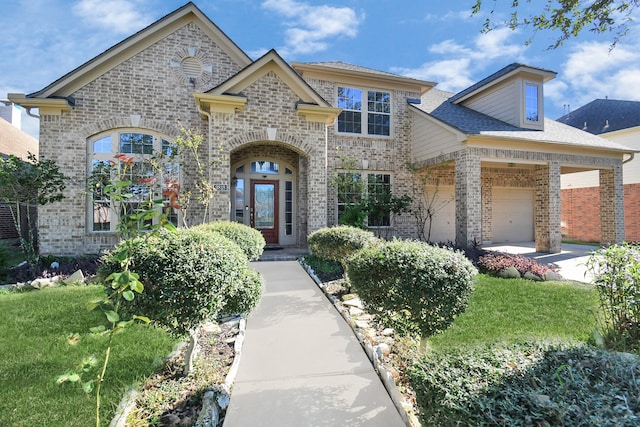 view of front of home featuring a garage and a front lawn