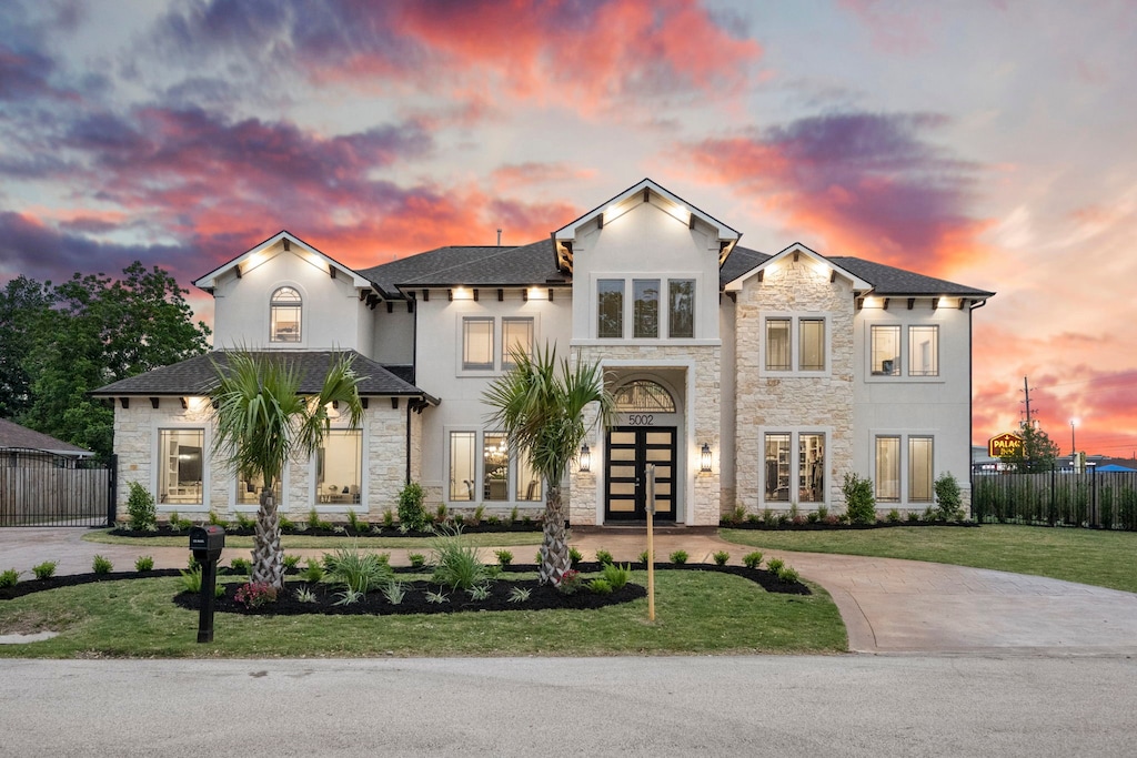 view of front of home with a lawn