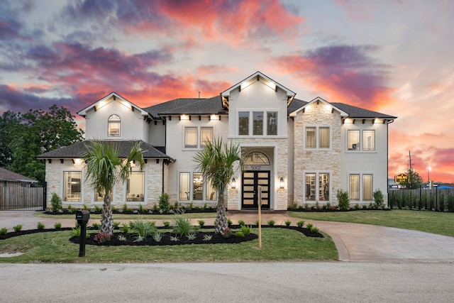 view of front of home with a lawn