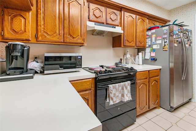 kitchen featuring light tile patterned floors and appliances with stainless steel finishes