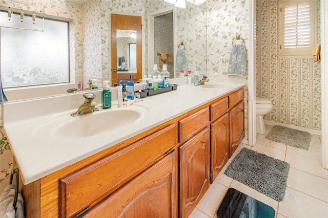 bathroom with tile patterned floors, vanity, and toilet