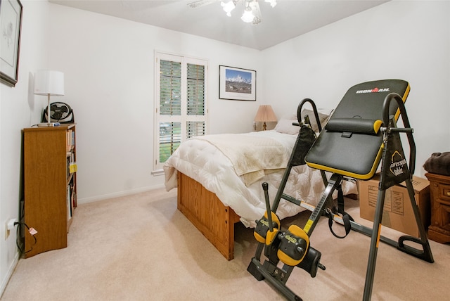 bedroom featuring light colored carpet