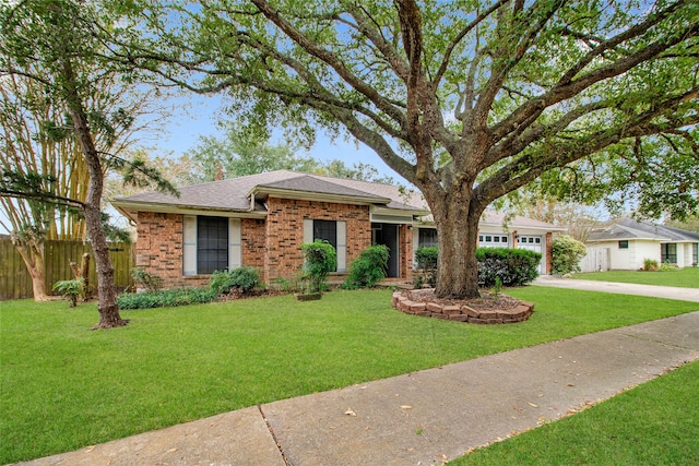 single story home featuring a front yard