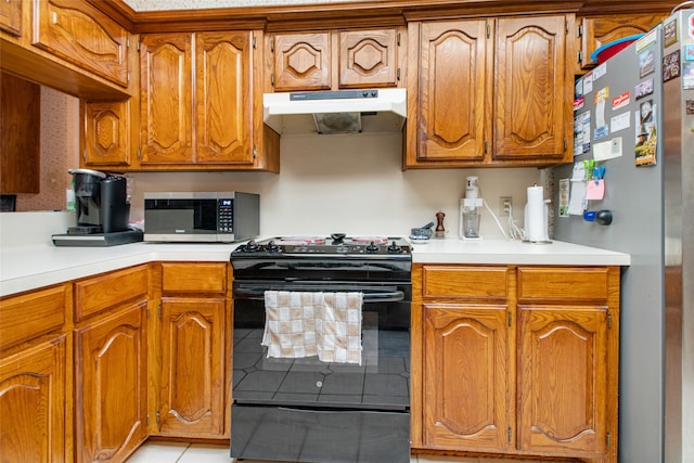 kitchen featuring light tile patterned floors and appliances with stainless steel finishes