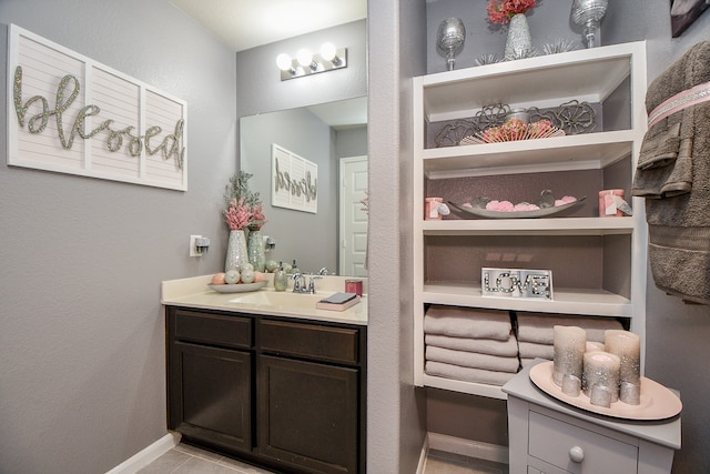 bathroom with tile patterned floors and vanity