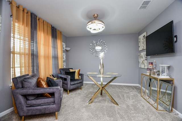 sitting room with carpet flooring