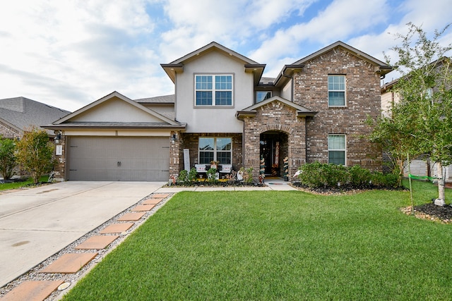 view of front of house with a garage and a front lawn