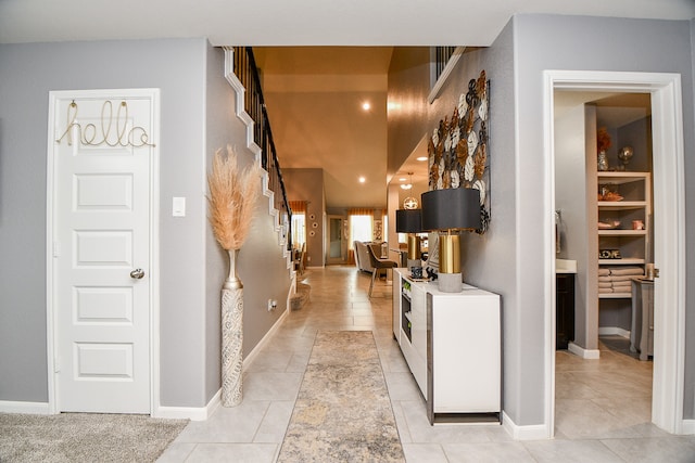 corridor featuring light tile patterned flooring