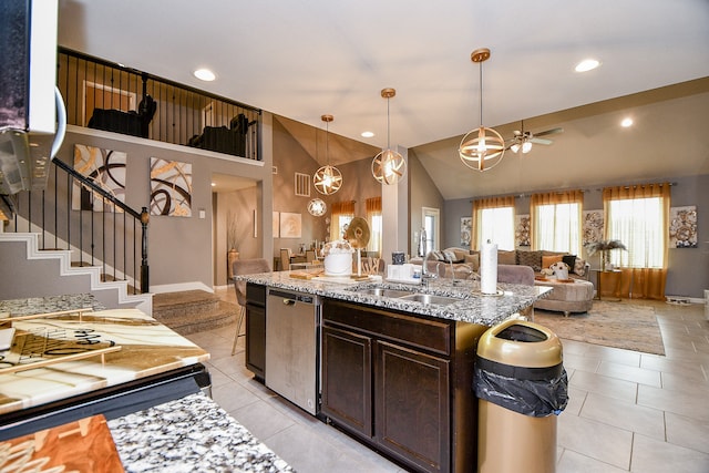 kitchen with dark brown cabinets, ceiling fan with notable chandelier, sink, light tile patterned floors, and hanging light fixtures