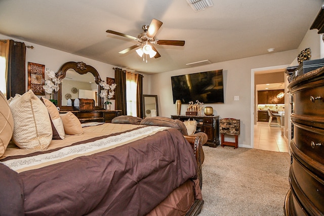 bedroom featuring ceiling fan and light colored carpet