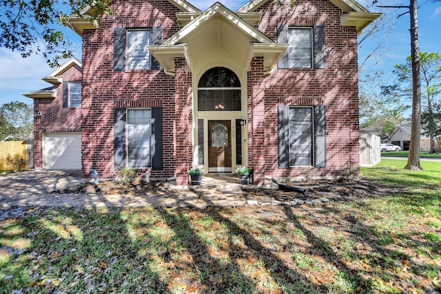 view of front facade featuring a garage and a front lawn