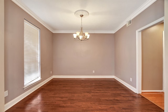 unfurnished room featuring dark hardwood / wood-style flooring, an inviting chandelier, and crown molding