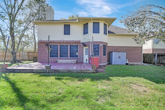 back of property featuring a lawn and a patio area