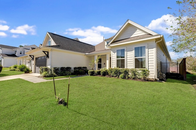 view of front of property with a garage and a front lawn