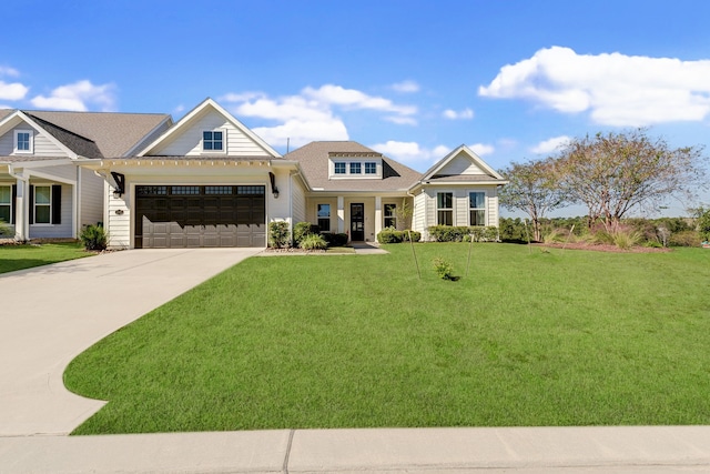 view of front facade featuring a garage and a front lawn