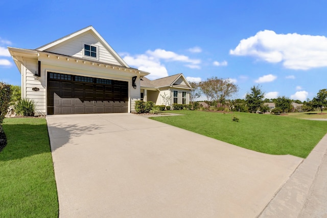 view of front of property featuring a garage and a front yard