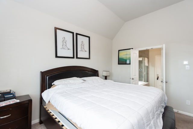 bedroom with carpet, vaulted ceiling, and ensuite bath