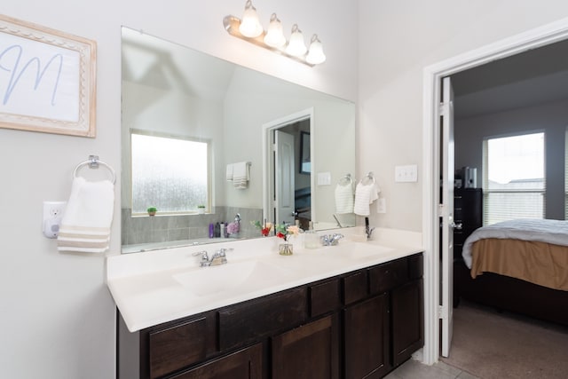 bathroom with tile patterned floors and vanity