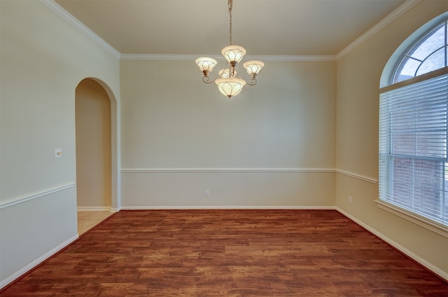 unfurnished room featuring wood-type flooring, ornamental molding, and a chandelier