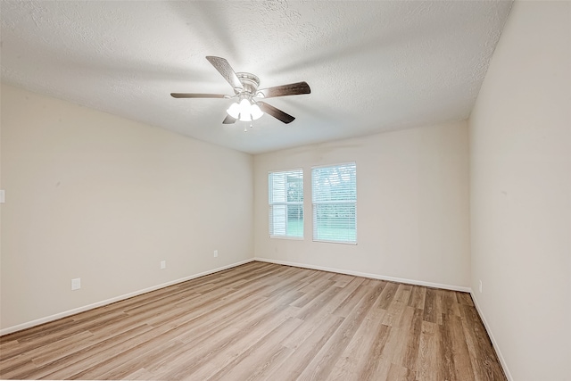 unfurnished room with a textured ceiling, light hardwood / wood-style floors, and ceiling fan