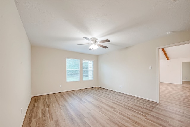 unfurnished room featuring ceiling fan, light hardwood / wood-style flooring, and a textured ceiling