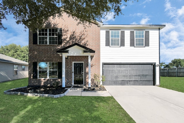 view of front of home featuring a garage and a front yard