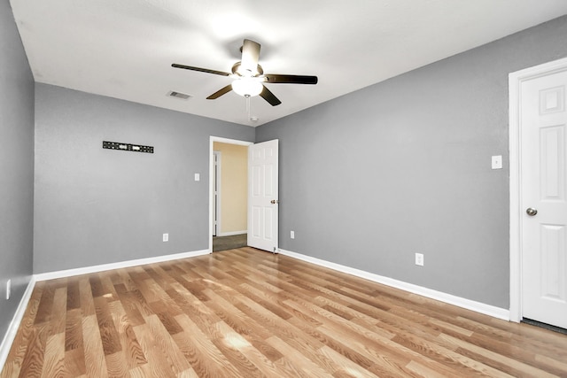 unfurnished bedroom featuring ceiling fan and light wood-type flooring