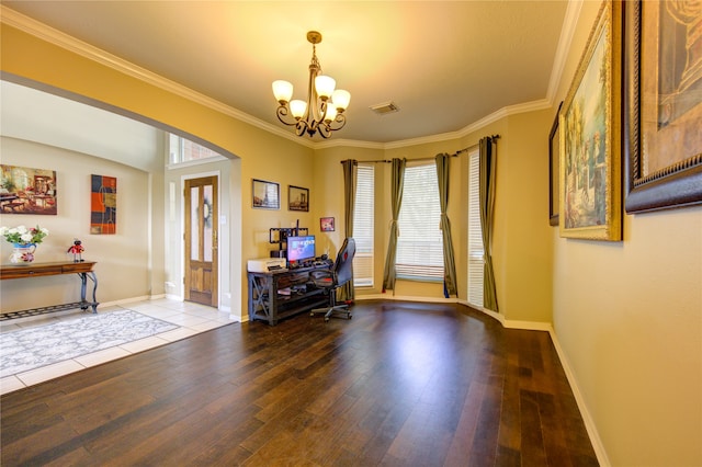 office with crown molding, an inviting chandelier, and hardwood / wood-style flooring