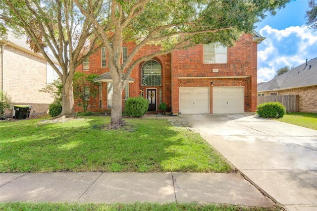 view of front of property featuring a garage and a front yard