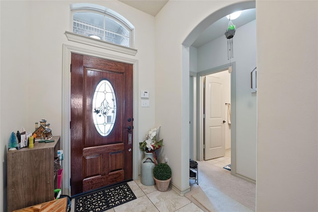 tiled entryway with a wealth of natural light