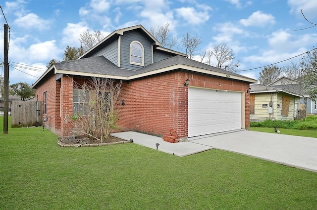 view of front of property with a garage and a front yard