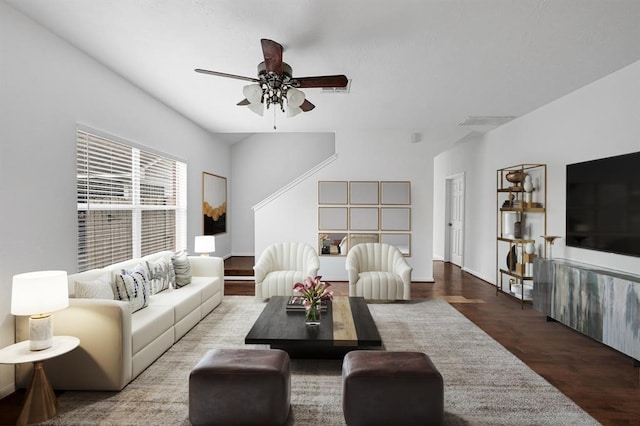 living room featuring hardwood / wood-style flooring and ceiling fan