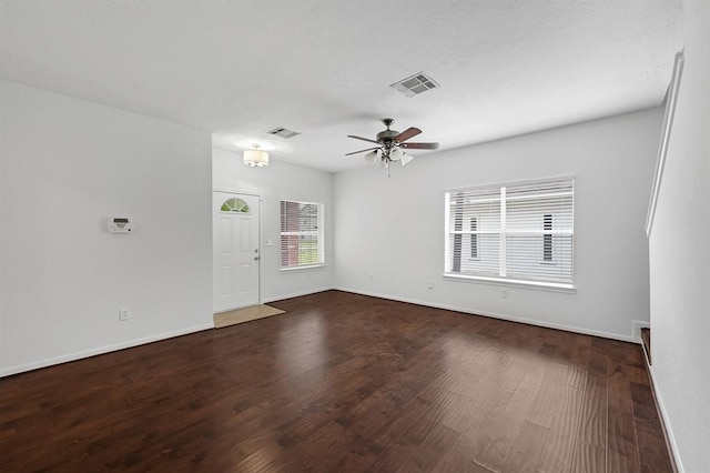 empty room with ceiling fan and wood-type flooring