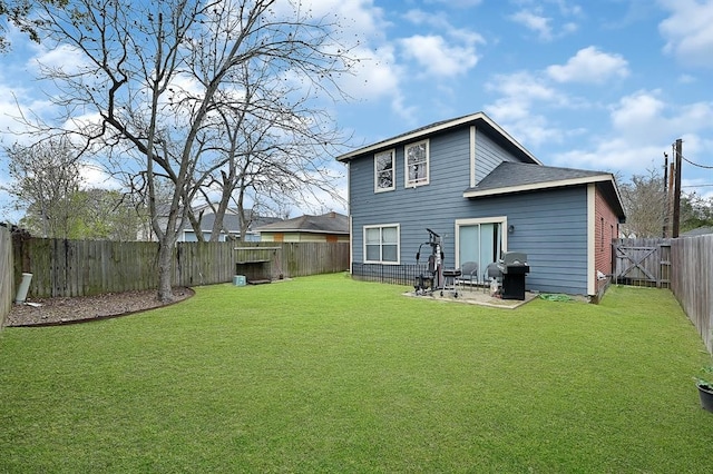 back of house featuring a patio area and a yard