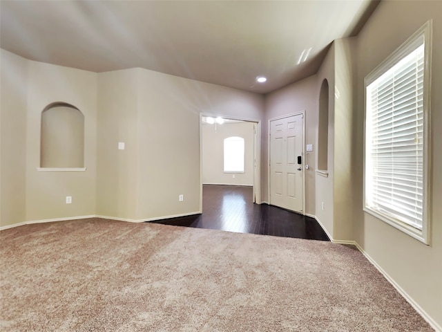 interior space featuring dark carpet