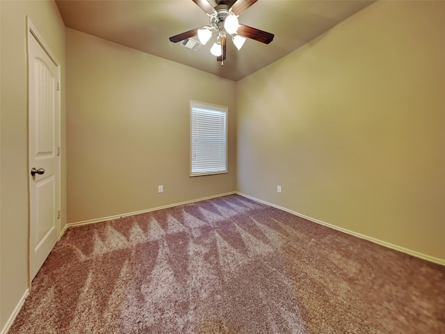 spare room with carpet floors and ceiling fan