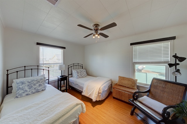 bedroom featuring ceiling fan and hardwood / wood-style flooring