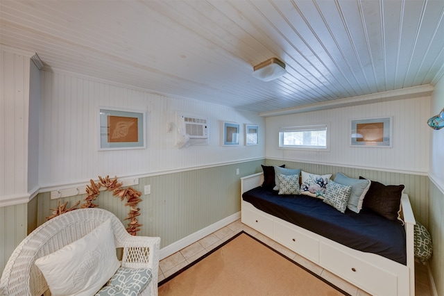 sitting room with wooden walls, tile patterned floors, an AC wall unit, and wood ceiling