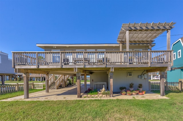 back of property featuring a yard, a pergola, a deck, and a patio area