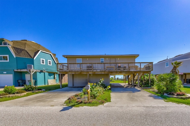 front facade with a garage and a deck