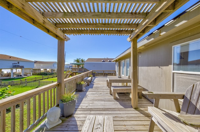 wooden terrace with a pergola and a yard