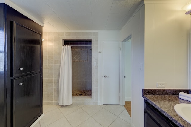 bathroom featuring vanity, tile patterned floors, curtained shower, and tile walls