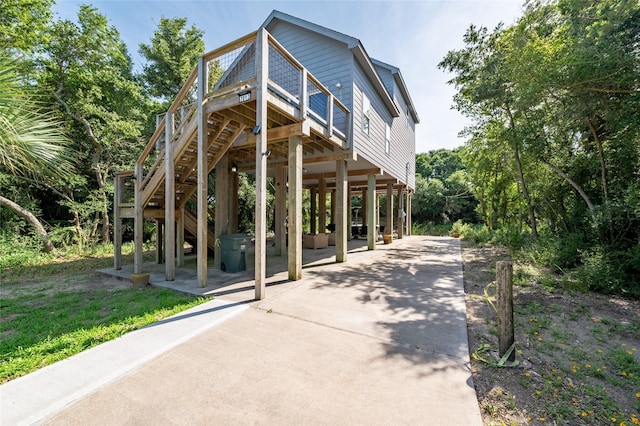 exterior space featuring a deck and a patio