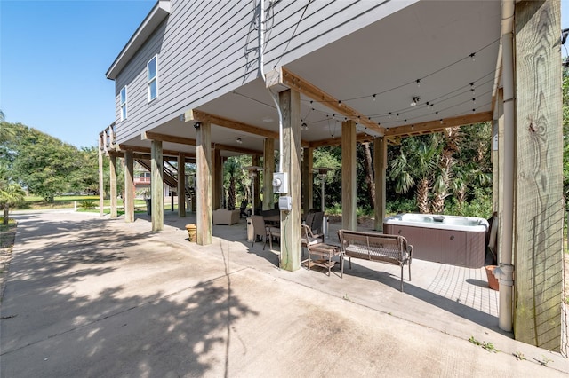 view of patio / terrace with a hot tub