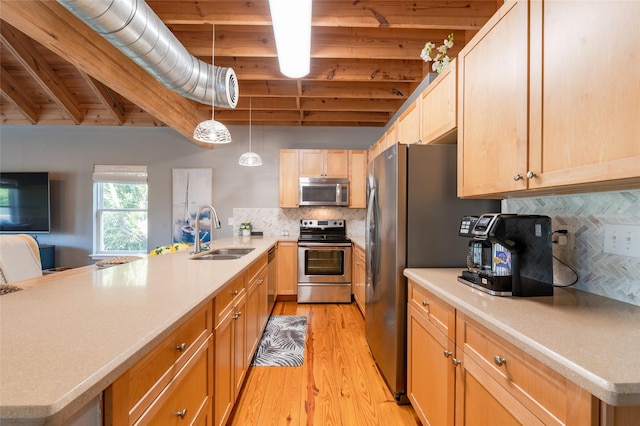 kitchen featuring beam ceiling, sink, light hardwood / wood-style flooring, decorative backsplash, and appliances with stainless steel finishes