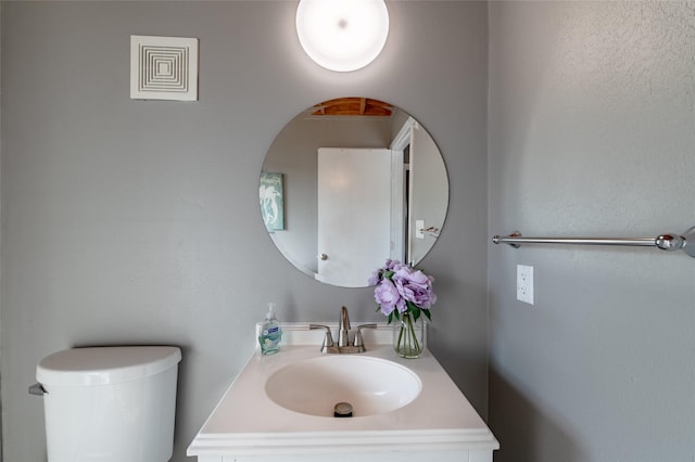 bathroom featuring toilet and sink