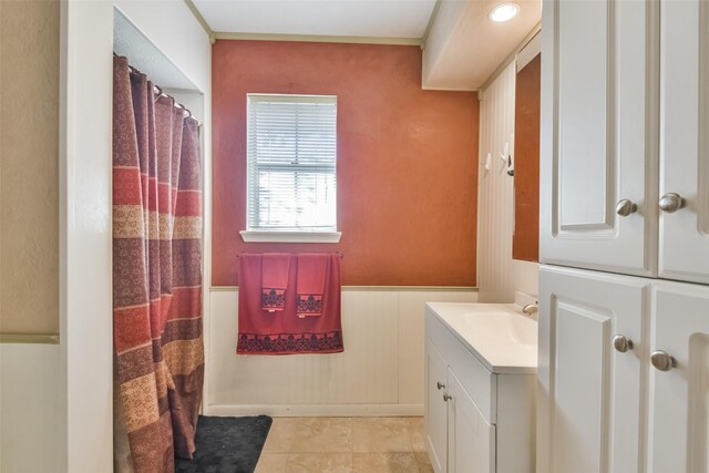 bathroom with tile patterned floors, vanity, and a shower with curtain